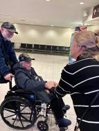 DAR members and veteran organizations in a heartfelt welcome for seven World War II Honor Flight veterans from Austin, Texas. 