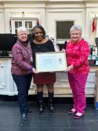 DAR Store Director Carolie Walker with the DAR Medal of Appreciation for 45 years of dedicated service