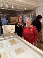 Ginnie Sebastian Storage, President General and Renee Pace, Curator General viewing Preserving Patriotism