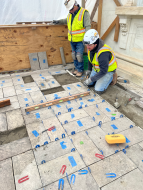 stone masons reinstalled the marble pavers in their original locations on the 17th Street Portico