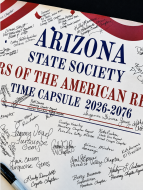 Members added their signatures to a banner that will become part of a time capsule to be opened during America's 300th anniversary celebration