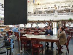 During a break Bill Paxton and the genealogist are able to chat about what he has discovered thus far. The beautiful DAR Library serves as their backdrop.