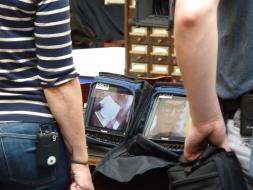 Filming close-up shots of the documentation containing information about Bill Paxton’s ancestor.