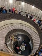 Looking down at a spiral staircase in the Vatican Museum.