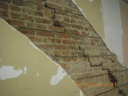 Even though work has started on repairing the crack in the wall, you can still see where it is.