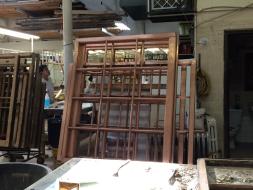 Stripped copper clad wood windows in the restoration shop