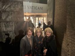 Mrs. Wright, Mrs. Lingelback, and Mrs. McNamara smile in front of the Vatican.