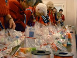 Adding the final touches on the toiletry packages