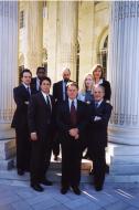 The cast of The West Wing posing outside DAR Headquarters.  Back row, left to right: Bradley Whitford, Dulé Hill, Richard Schiff, Janel Moloney, and Allison Janney. Front row, left to right: Rob Lowe, Martin Sheen, and John Spencer.