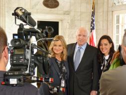 Amy Poehler star of Parks and Recreation, along with cast mate Aubrey Plaza, pose with Senator John McCain during a filming break in the Pennsylvania Foyer.