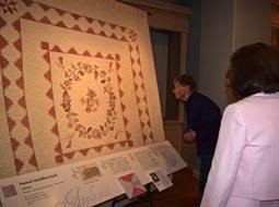 Visitors take in the quilts at the “Eye on Elegance” opening October 2014.